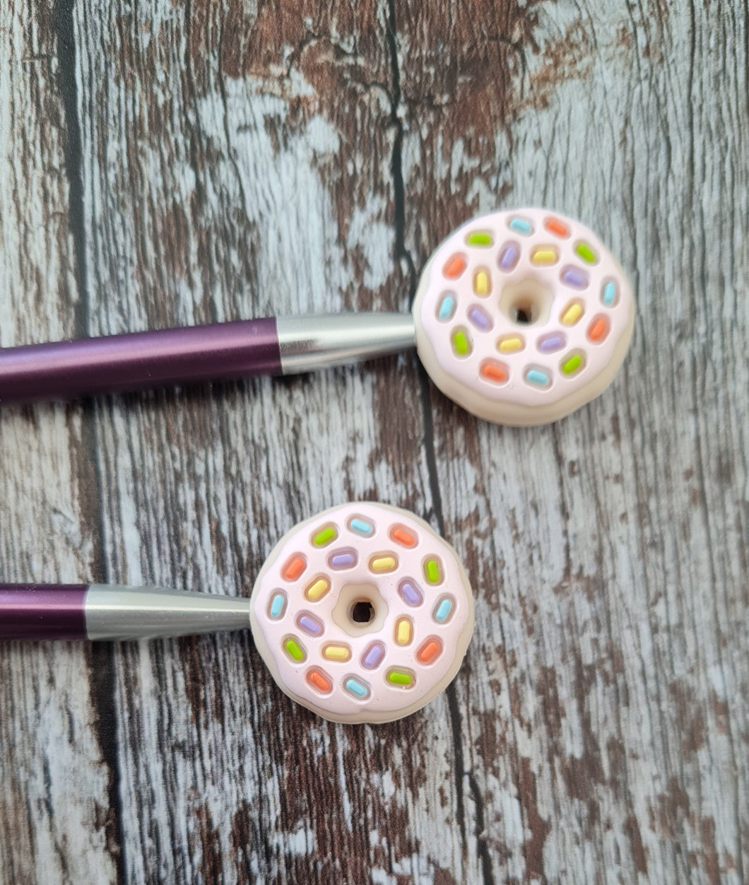 Knitting stoppers.Donuts with sprinkles.