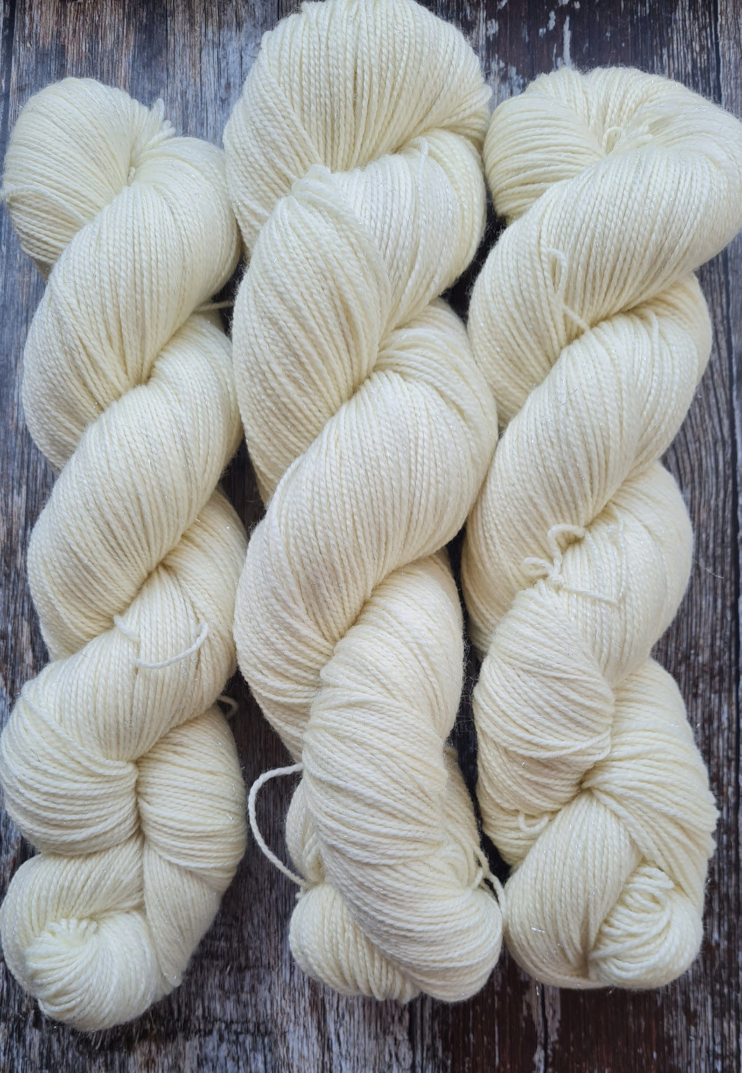 Natural undyed, superwashed merino  nylon silver sparkle.75/20/5 100g 4ply.